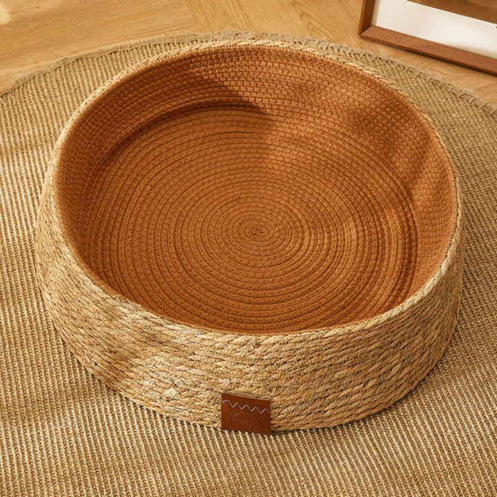 Rattan cat scratching bed, hand-woven from natural materials. Provides a durable surface for feline nail care.