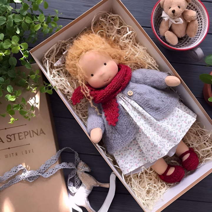 Handmade Waldorf doll, charming and soft, made with natural fibers for imaginative play.