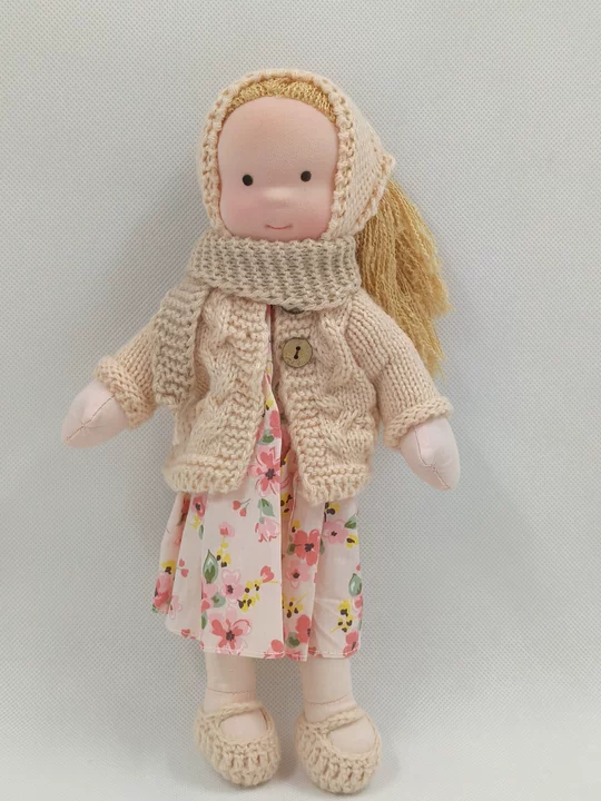 Handmade Waldorf doll for children, soft, durable natural fabric toy, perfect for imaginative play and comfort.
