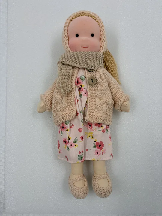 High-quality handmade Waldorf doll, soft natural fabric, durable, simple design for children's creative play.