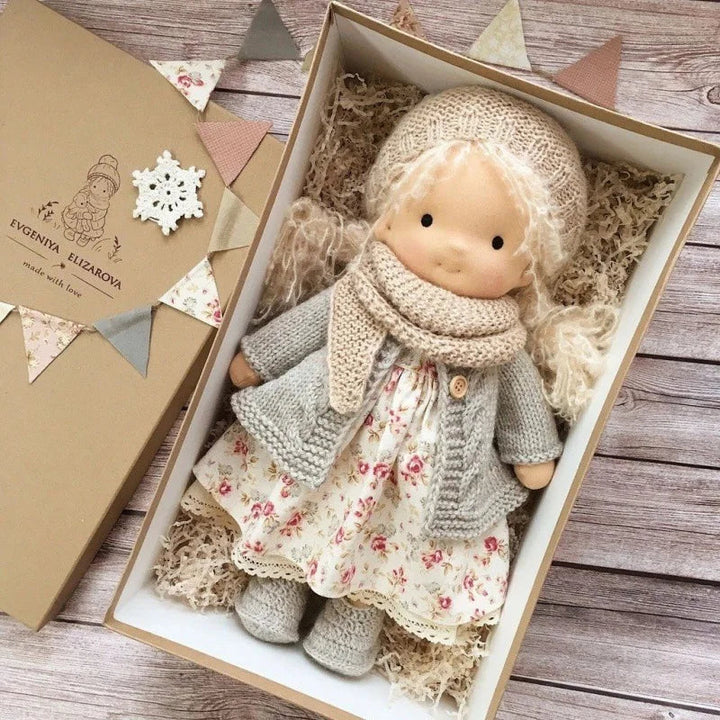 Charming handmade Waldorf doll, cotton fabric toy, perfect for young children.