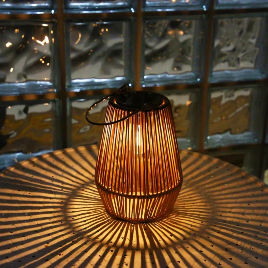 Handwoven solar garden lamp with intricate design, LED light, and waterproof finish, perfect for sustainable outdoor decor.