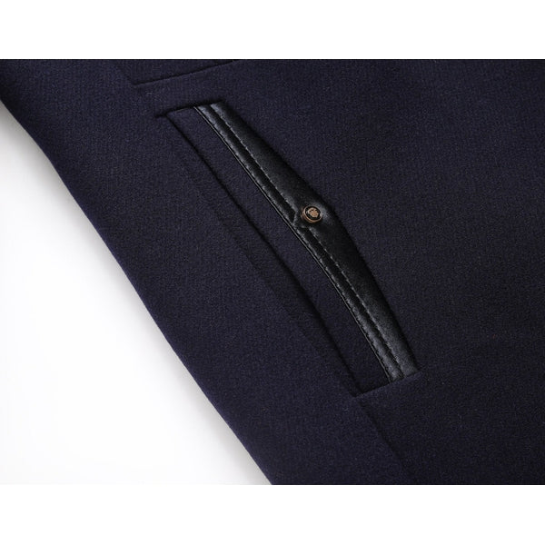 Close-up of a men's elegant overcoat, highlighting the mandarin collar & sophisticated button-front design.