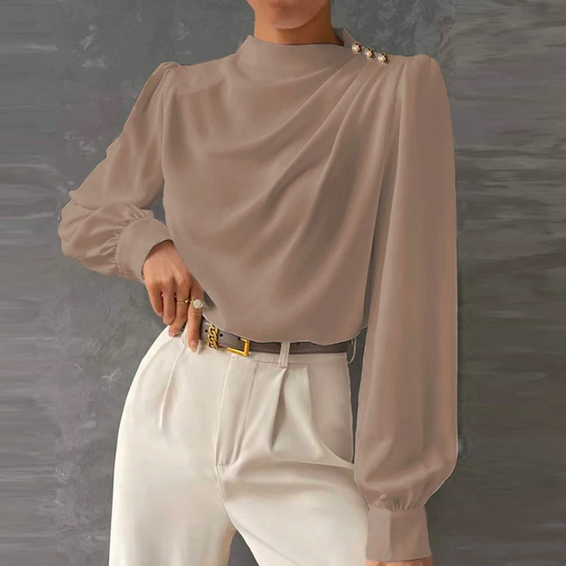 Women's relaxed fit elegant blouse. Chic long sleeve top with a comfortable, versatile design.