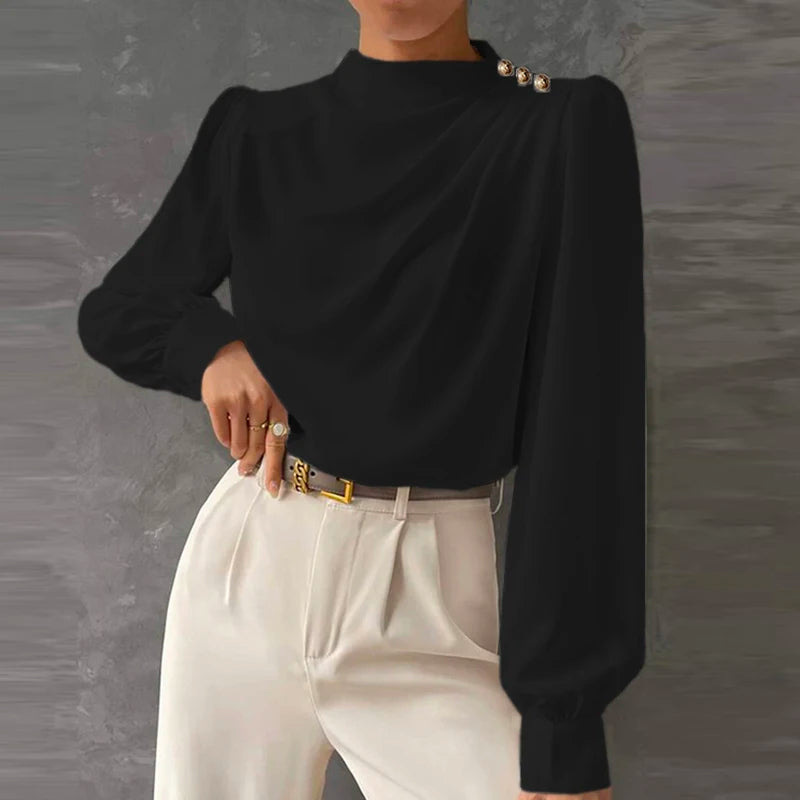 Versatile women's elegant blouse. Relaxed fit long sleeve top, ideal for various fashion occasions.