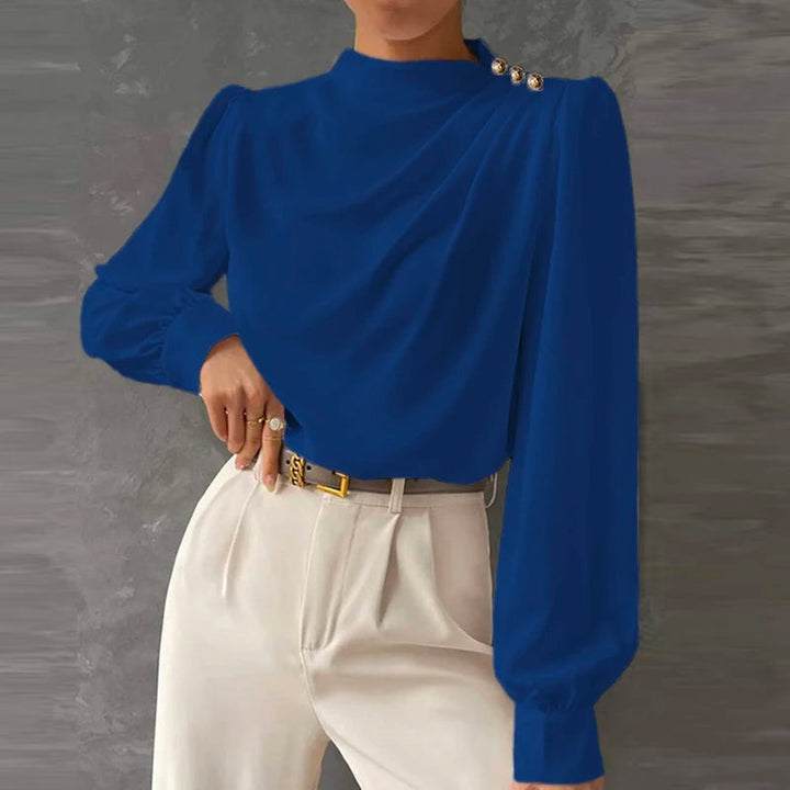 Chic women's relaxed fit blouse, featuring an elegant high neck and long sleeves. A versatile fashion top.