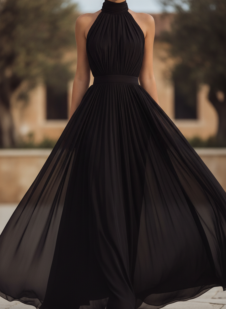 Elegant women's halter neck pleated maxi dress, perfect for formal evening wear or as a wedding guest.