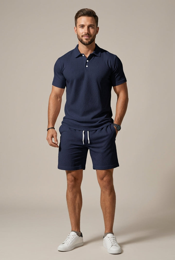 Men's textured two-piece polo shirt and drawstring shorts set for casual summer wear. Comfortable & stylish leisure outfit.
