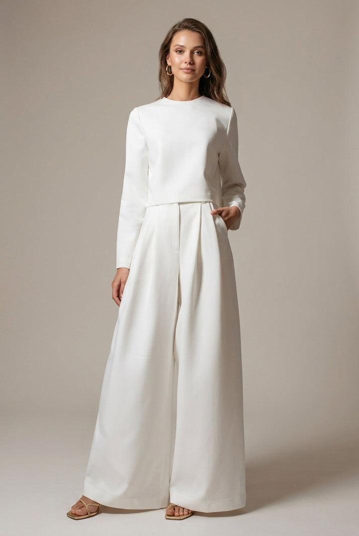 Elegant women's two-piece wide-leg palazzo outfit with a chic crop top, perfect for casual or workwear.