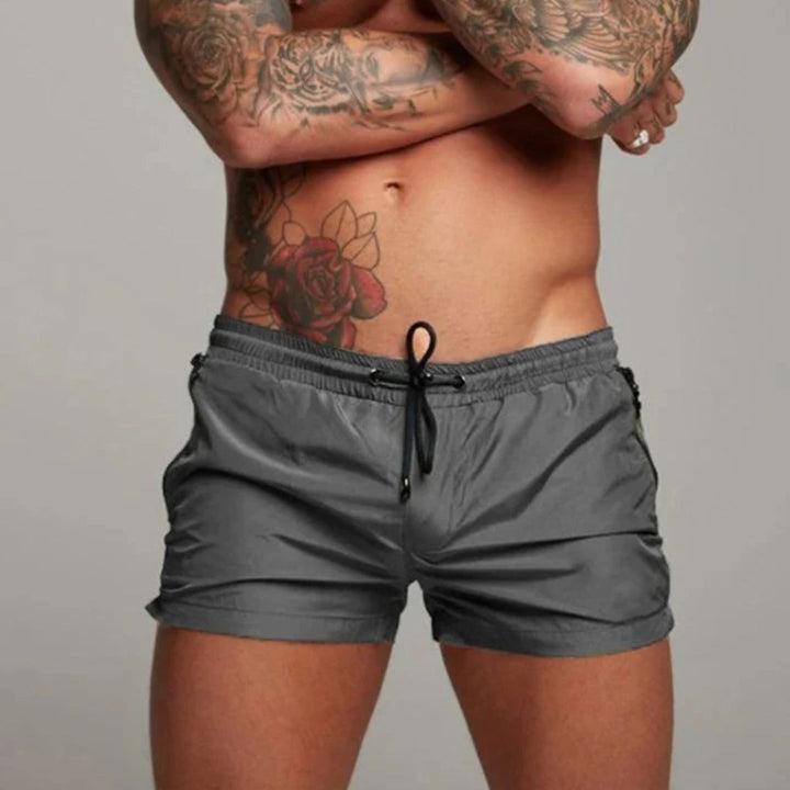 Comfortable men's athletic quick-dry shorts, ideal for swimming, casual wear, or summer adventures.