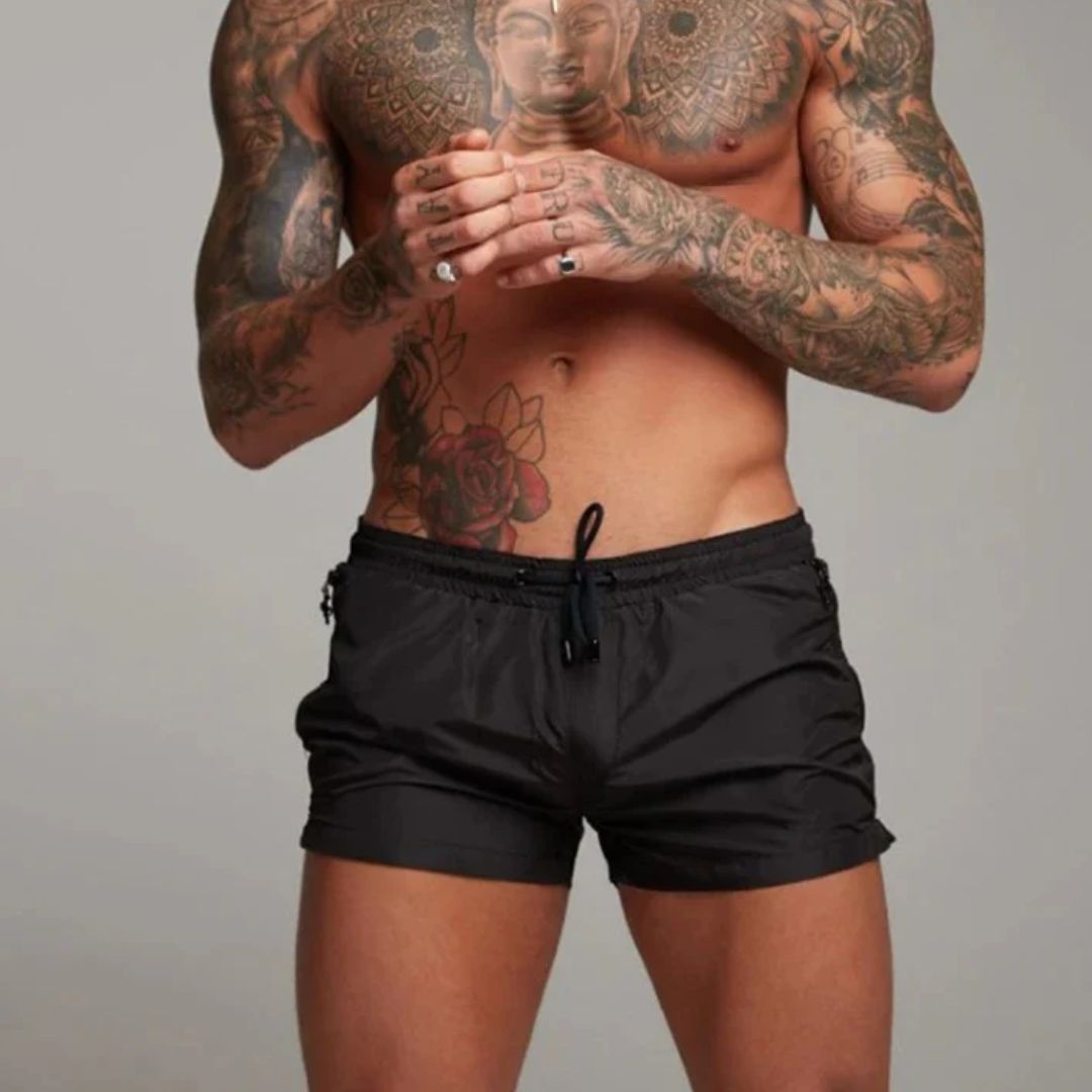 Stylish men's beach shorts, quick-drying for swimming or summer fashion. Essential for poolside style.