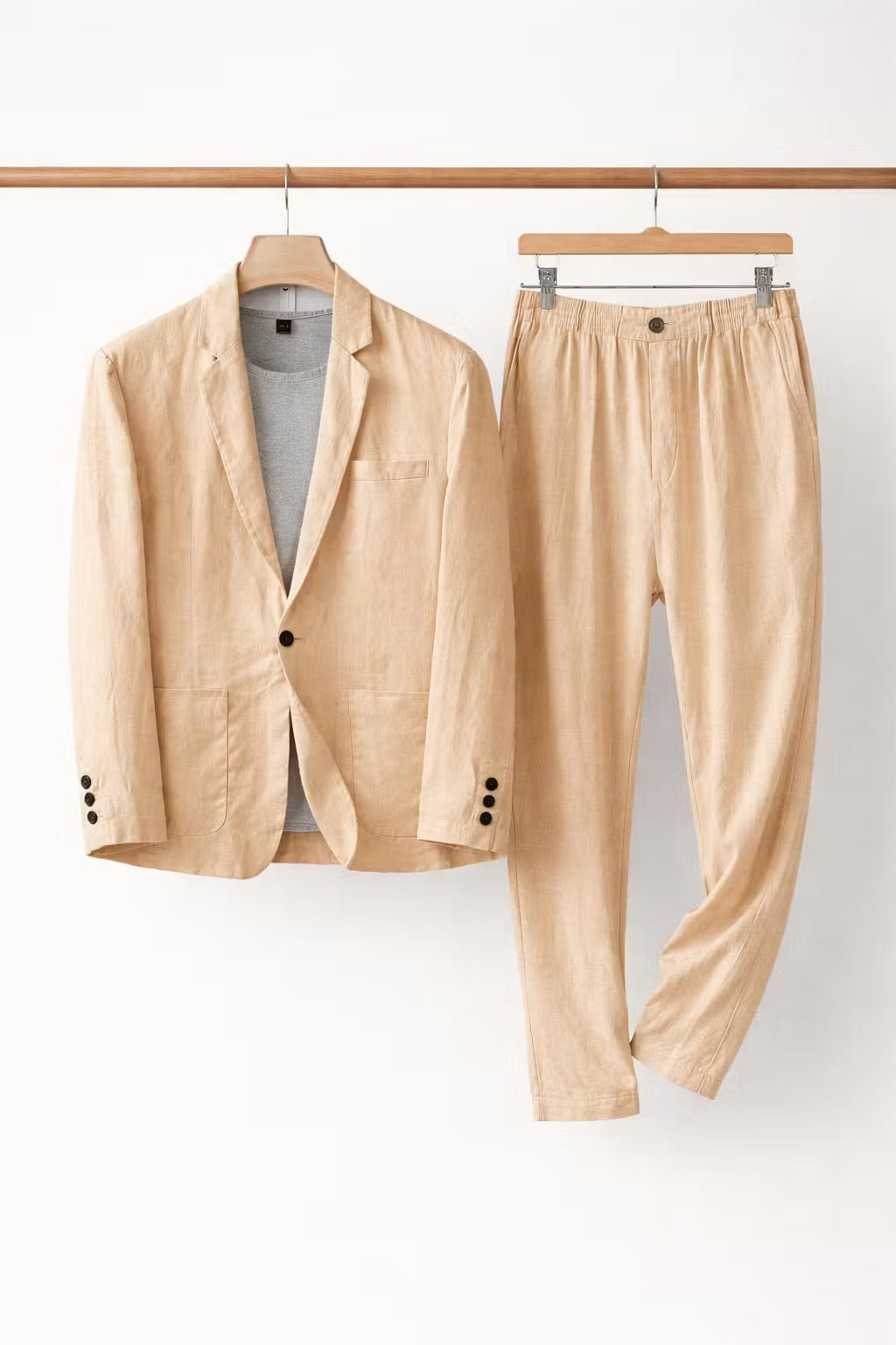 Side view of men's relaxed fit suit showing stylish drape of the two-piece blazer & comfortable trousers.