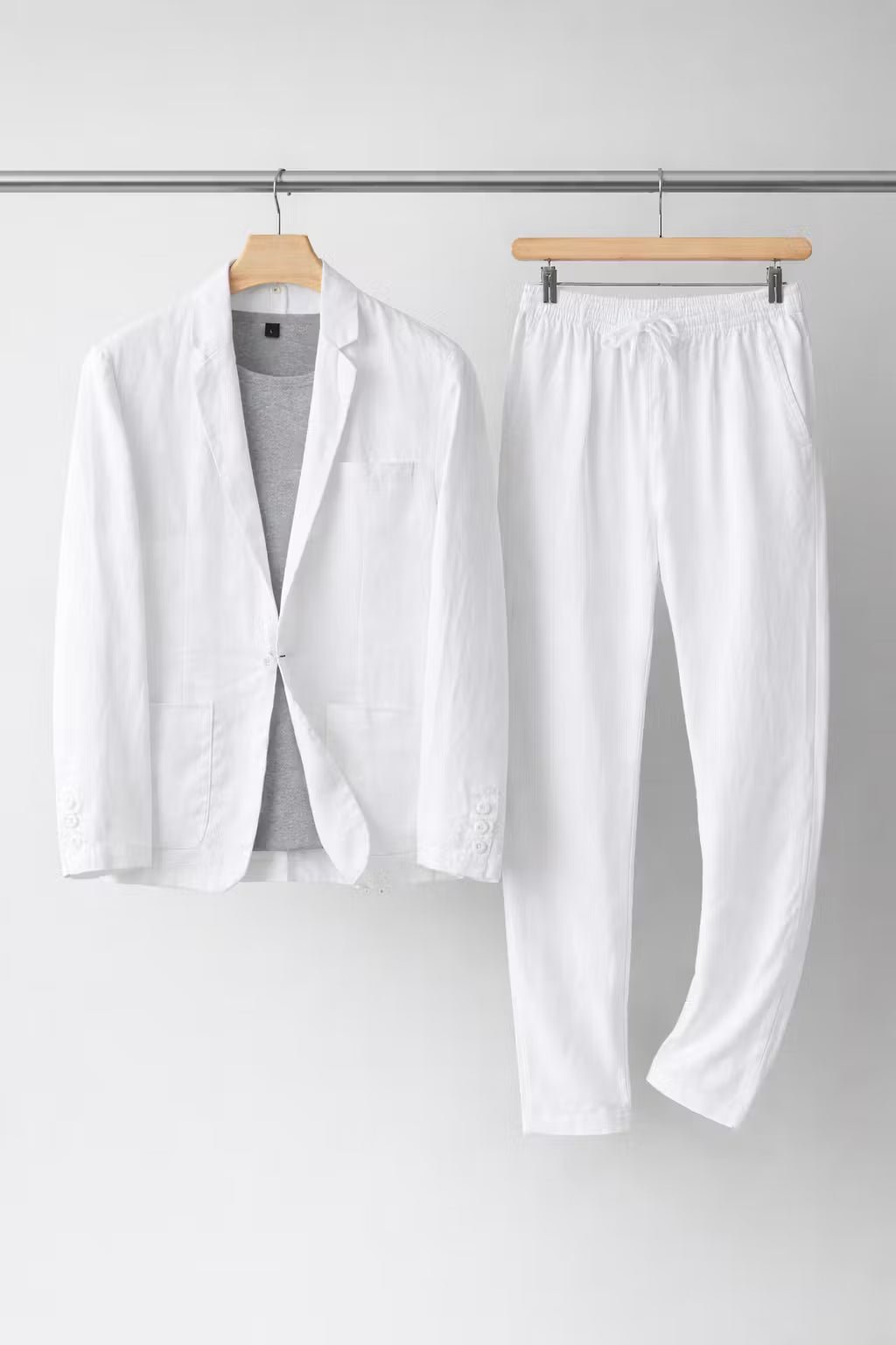 Close-up of the breathable fabric on a men's relaxed fit two-piece suit blazer, highlighting comfort.