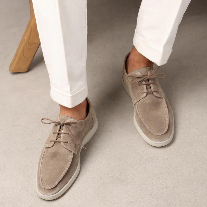 Stylish men's comfortable casual sneakers. Versatile suede lace-up footwear for everyday and walking, blending modern style.