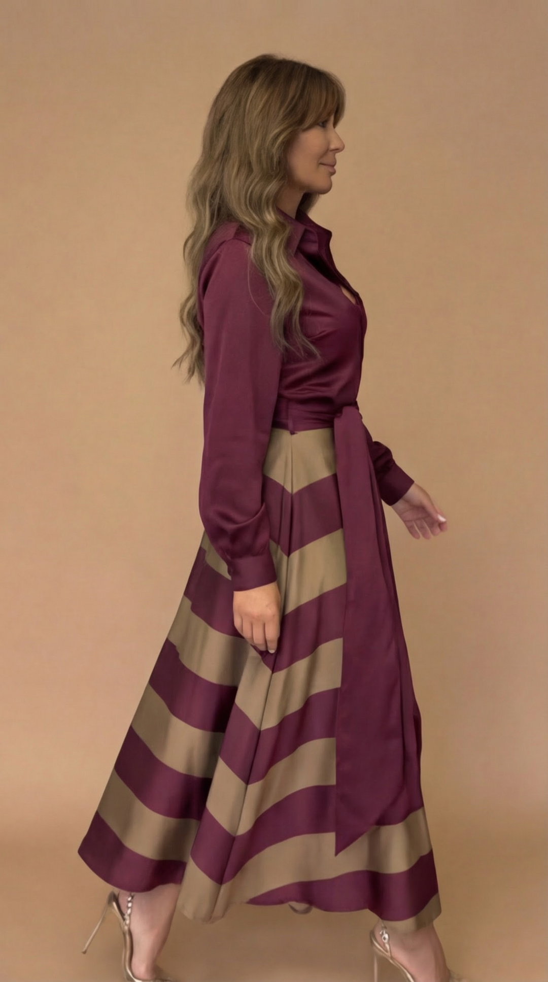 Close-up of the elegant bow detail on a women's versatile long dress, highlighting its unique design.