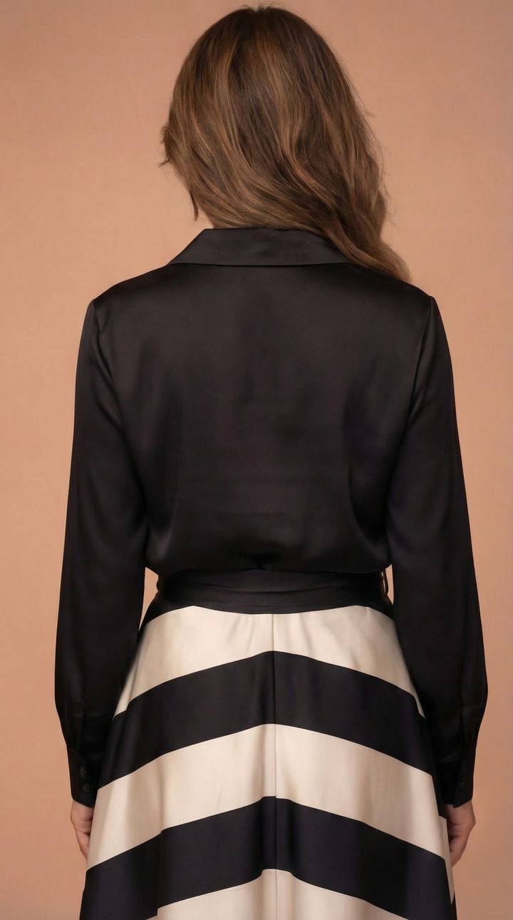 A long, elegant women's dress featuring a stylish bow detail, perfect for a sophisticated and comfortable look.