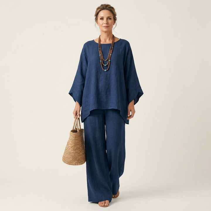 Women's matching linen blend two-piece set in a boho style. Features relaxed fit top and wide-leg elastic waist pants.