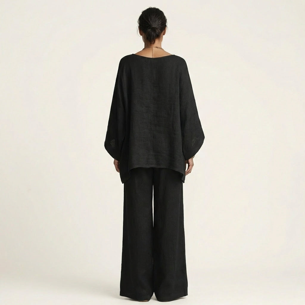 Stylish women's linen blend two-piece set with a boho vibe. Relaxed fit top & wide-leg pants, perfect for summer.