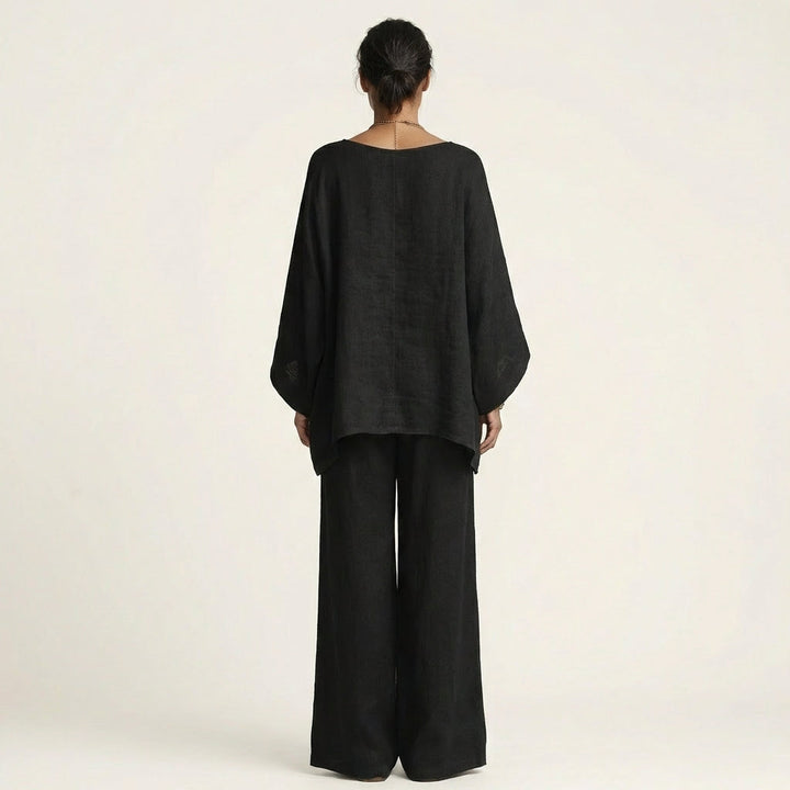 Stylish women's linen blend two-piece set with a boho vibe. Relaxed fit top & wide-leg pants, perfect for summer.