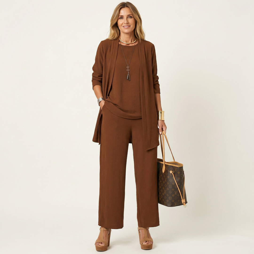 Sophisticated women's minimalist 3-piece set with a vest, blouse, and wide-leg trousers, perfect for office or events.