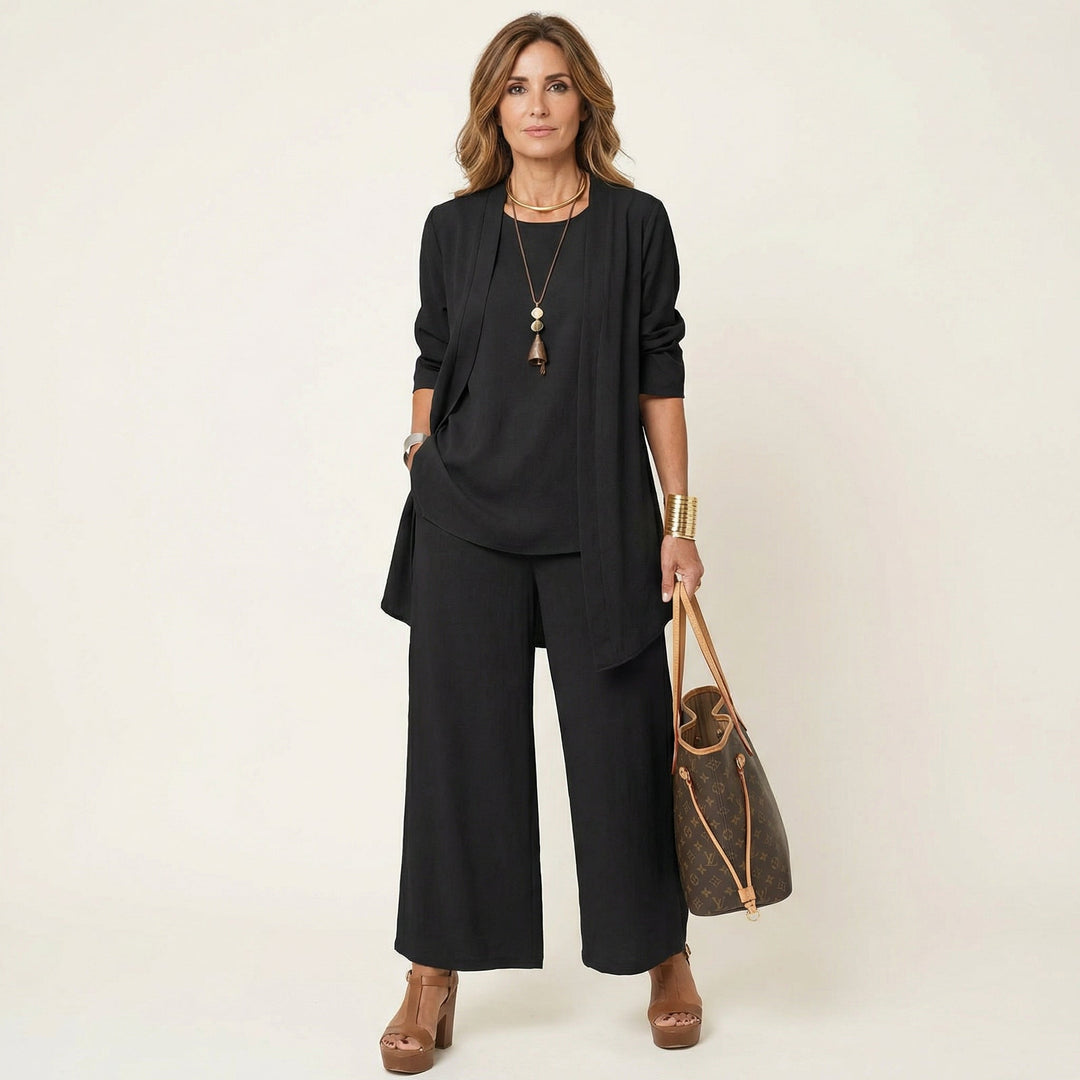Women's minimalist 3-piece set: vest, blouse & wide-leg trousers for an elegant, versatile look.