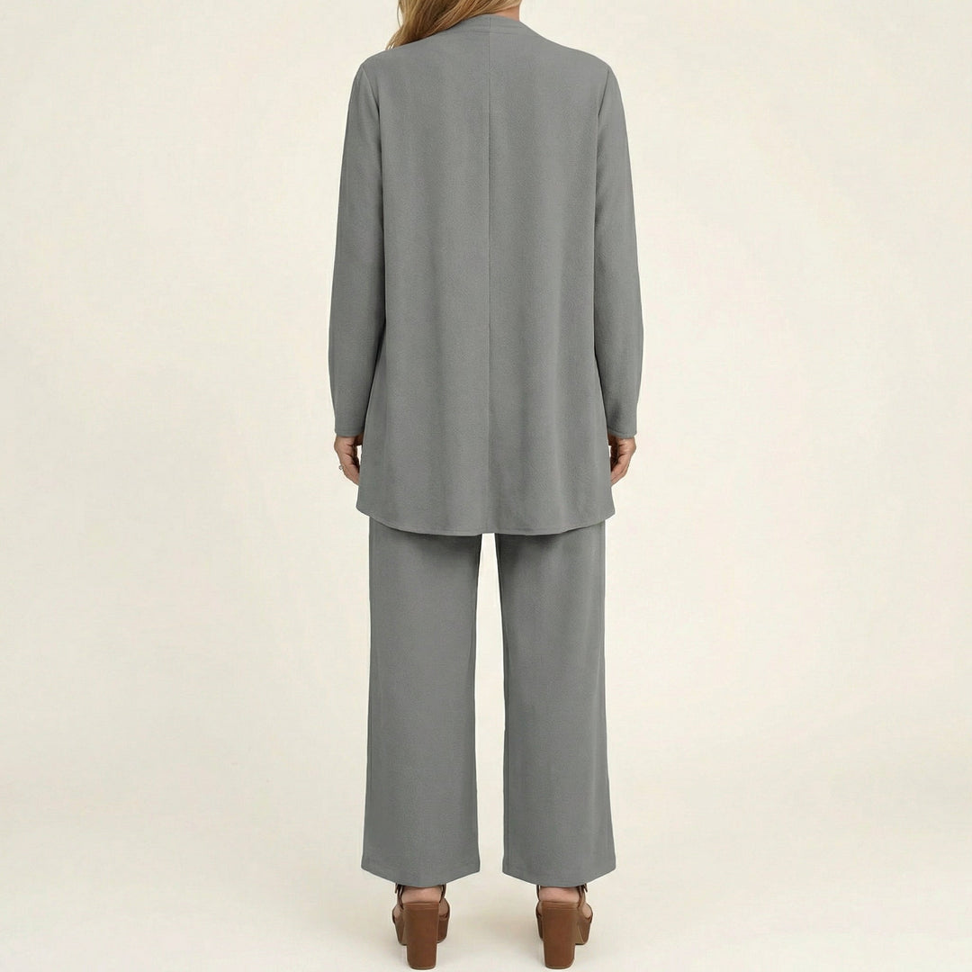 Formal or casual women's minimalist 3-piece set: a modern vest, blouse, & wide-leg trousers for a polished look.