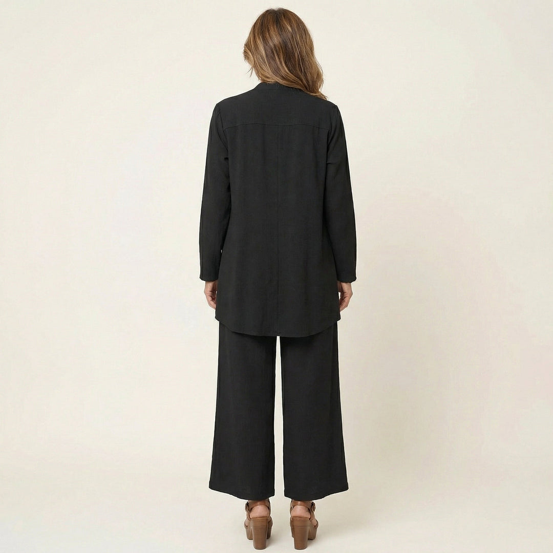 Elegant women's minimalist 3-piece set featuring a vest, blouse, & wide-leg trousers for business casual.