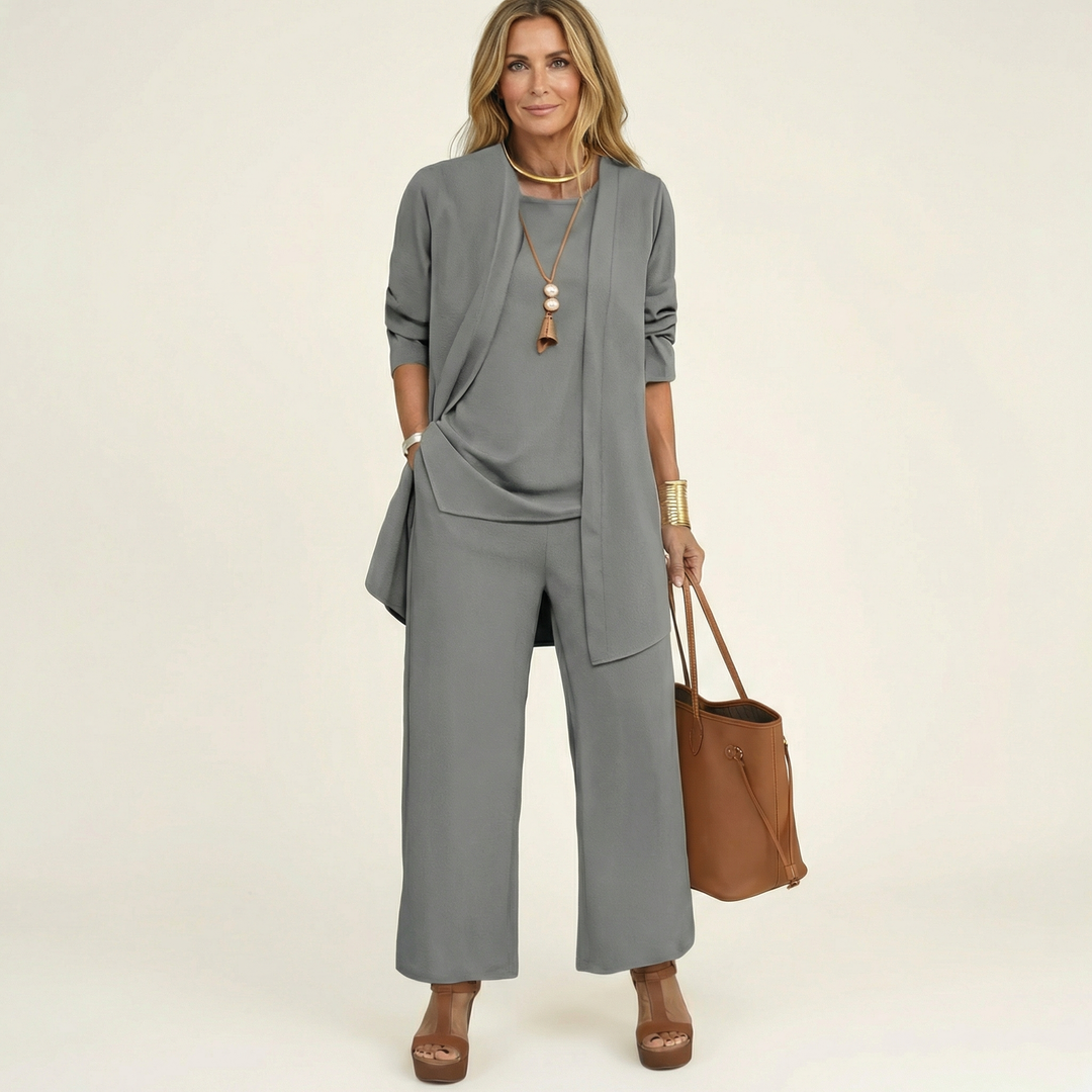 Chic women's minimalist 3-piece set with a tailored vest, elegant blouse & flowing wide-leg trousers.