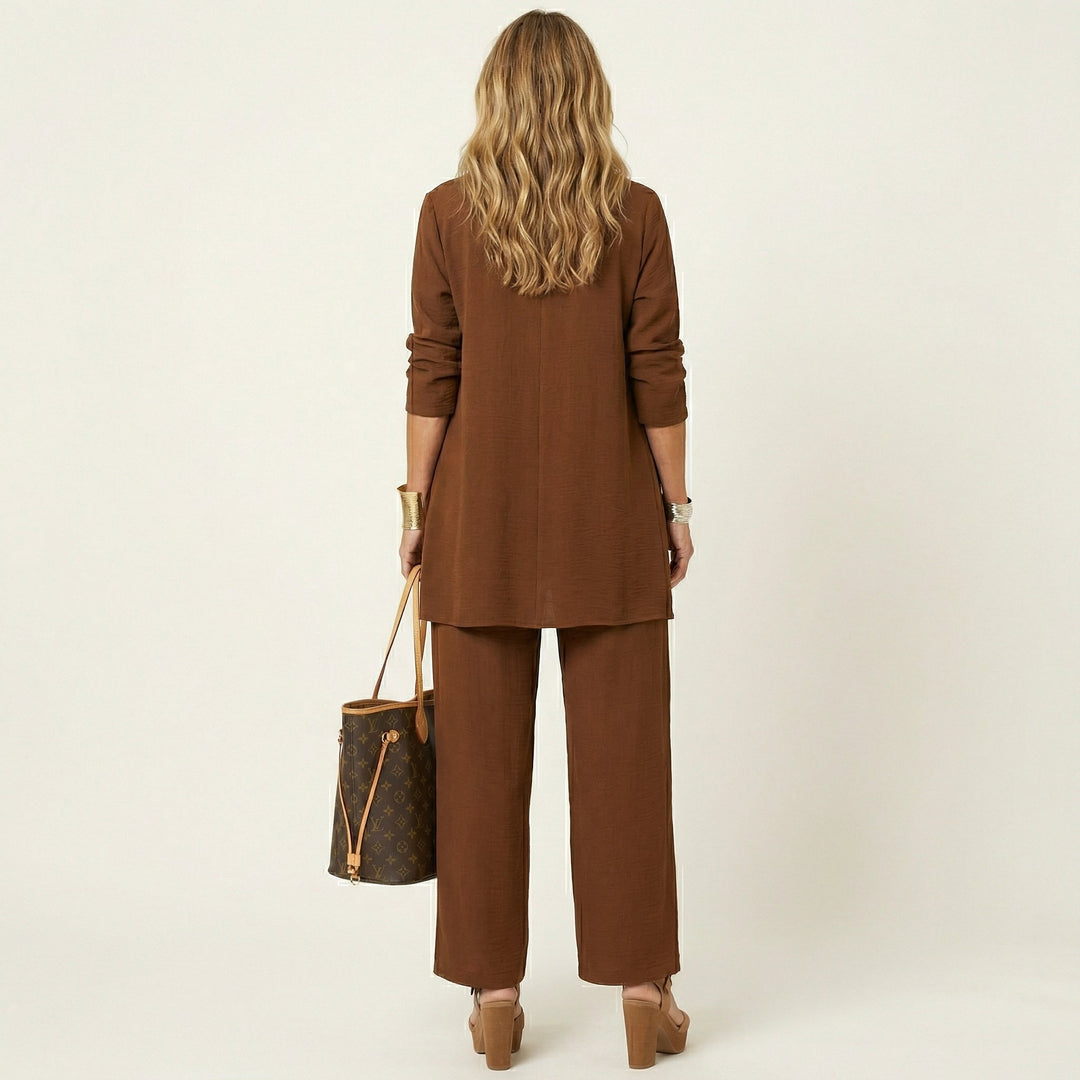 Sleek women's minimalist 3-piece ensemble: vest, blouse, & wide-leg trousers. Ideal for a refined, modern wardrobe.