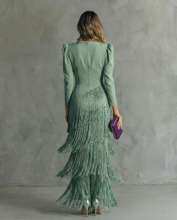 Sophisticated women's midi dress with a flowy V-neck, long sleeves & chic fringe detailing for evening wear.