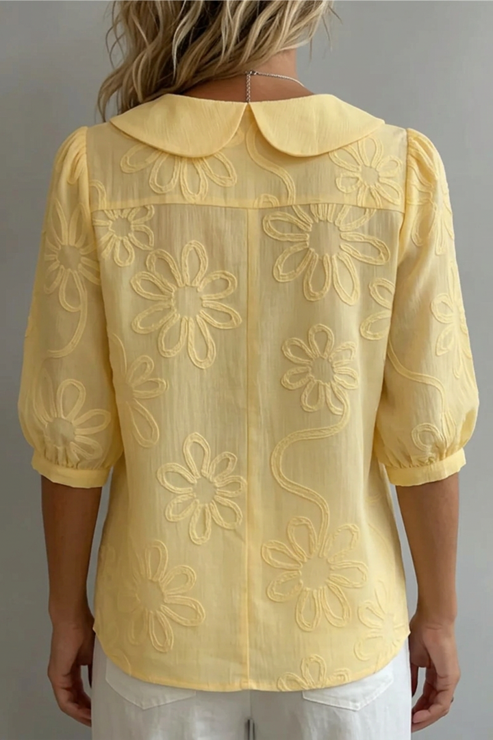 Feminine floral top for women. Elegant design perfect for spring fashion, casual outings, or office wear.