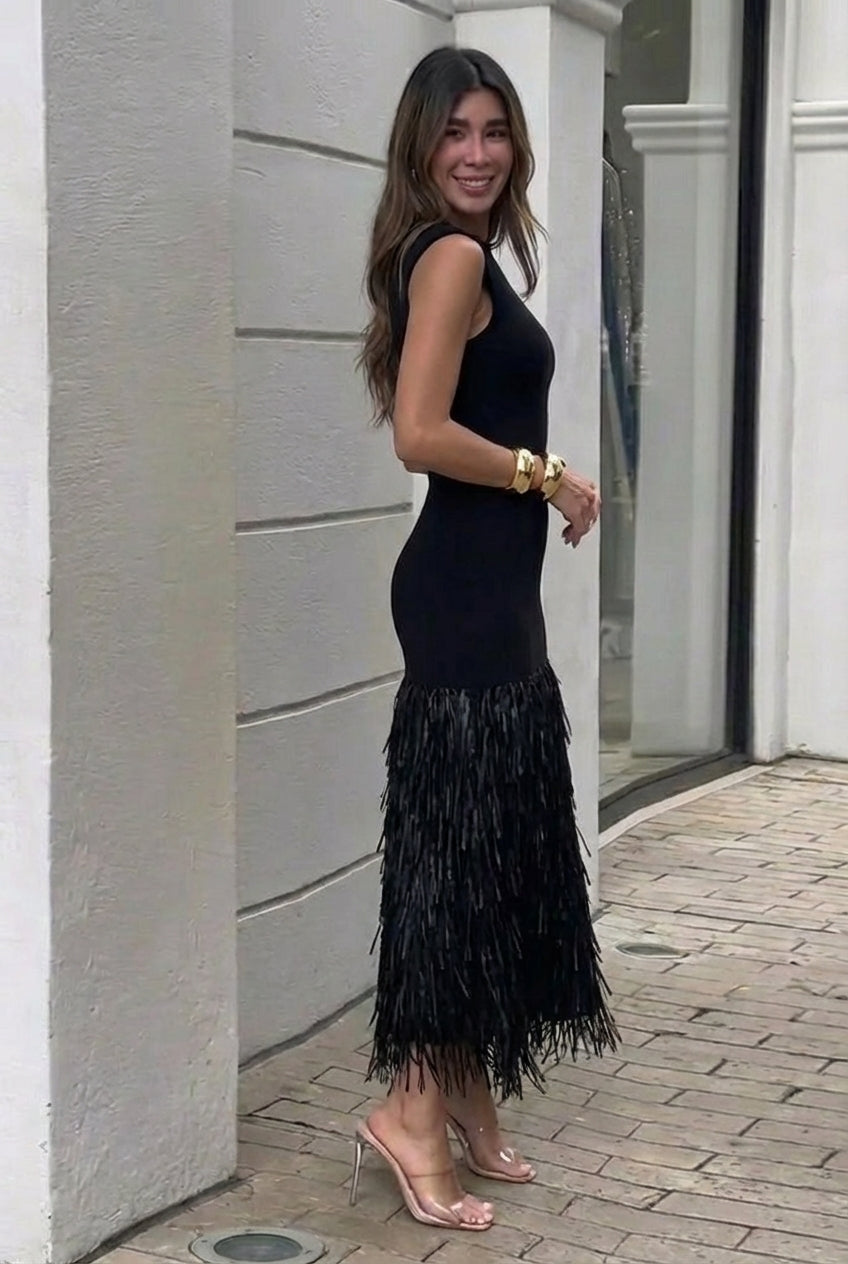 Women's sophisticated long fringe black maxi dress, a statement evening gown for elegant special occasions.