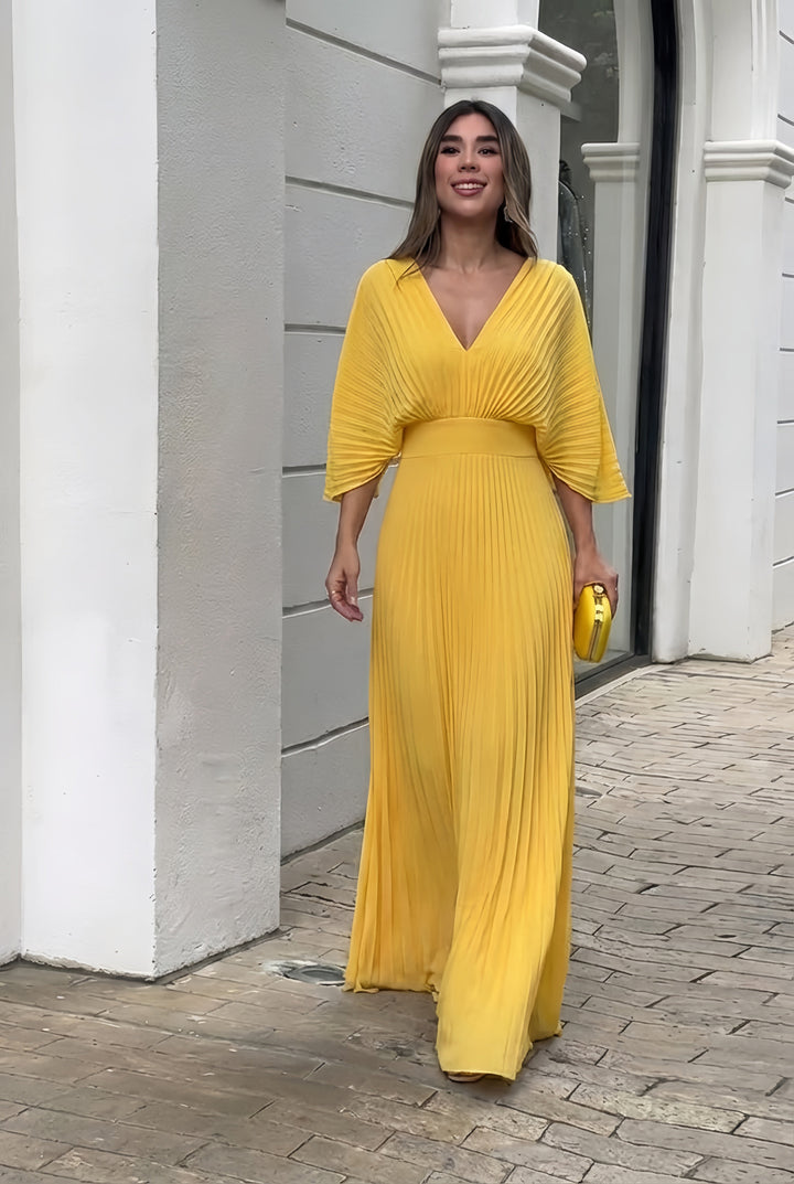 Elegant women's pleated maxi dress with kimono sleeves, perfect for evening or formal occasions.