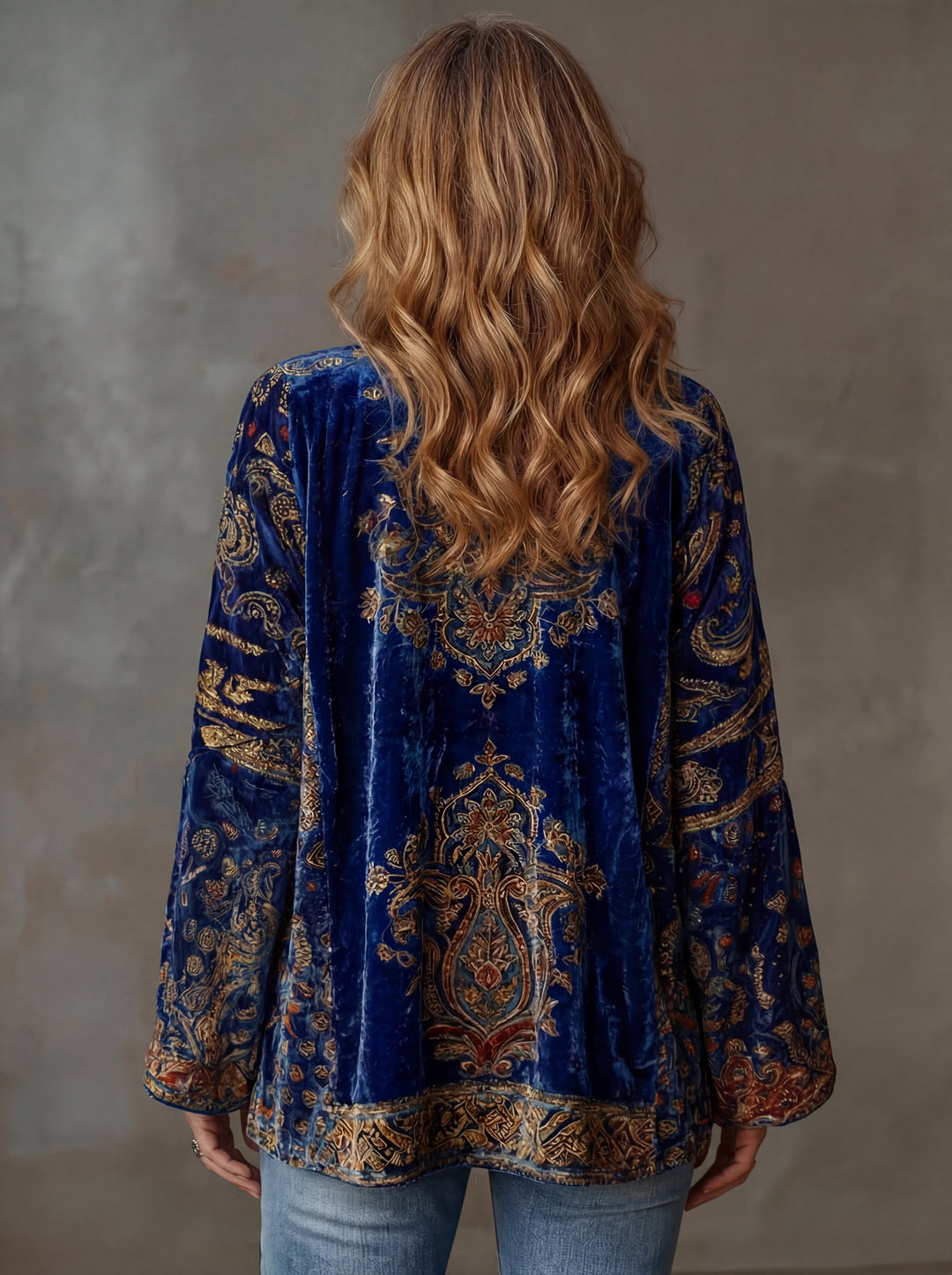 Women's patterned long cardigan with a rich Bohemian design, offering elegant layering options.