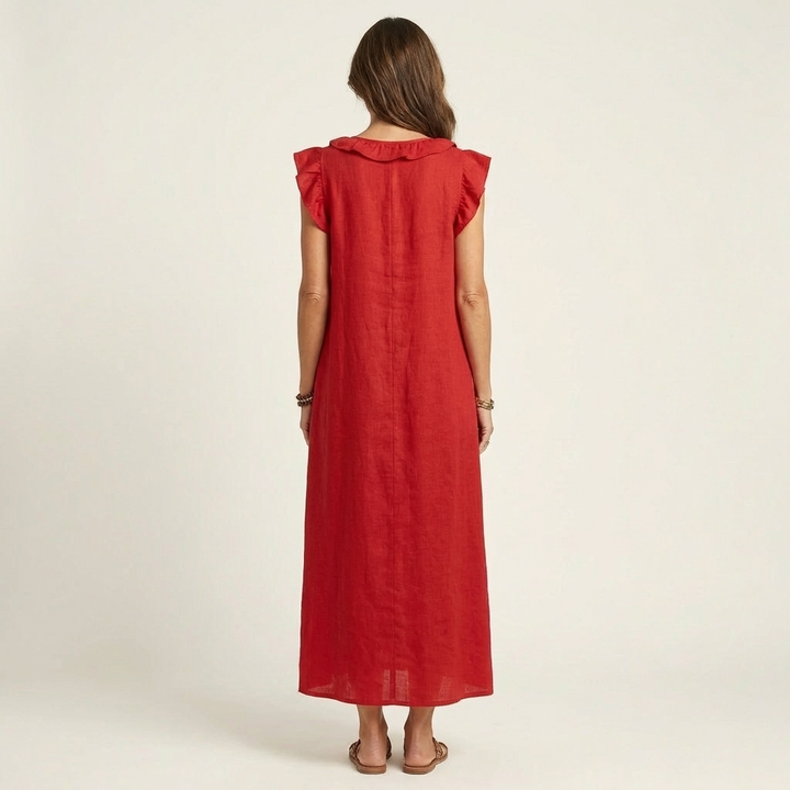 Flowing women's maxi dress featuring an elegant V-neck and delicate ruffles, great for holidays.