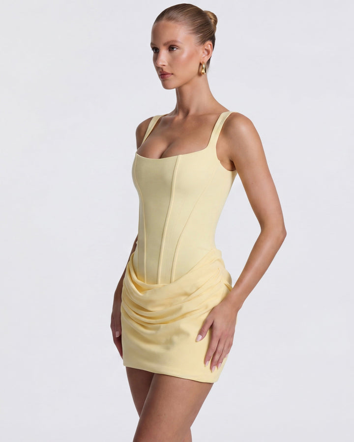 Chic women's cocktail dress. Sculpted silhouette, draped corset mini dress design.
