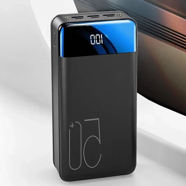 "High capacity portable power bank, sleek black design, for charging phones, tablets, and laptops on the go efficiently."