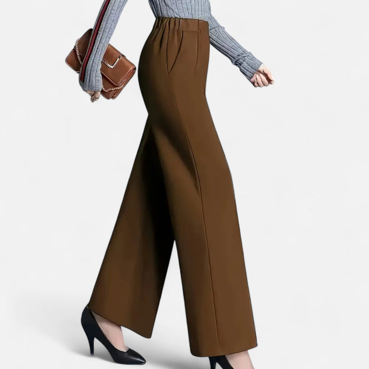 Navy blue high-waist wide-leg women's trousers, offering a chic, versatile, and comfortable look.