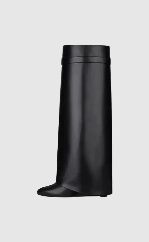 Fashionable glossy knee-high boots for women, designed with a sculptural wedge heel for winter.