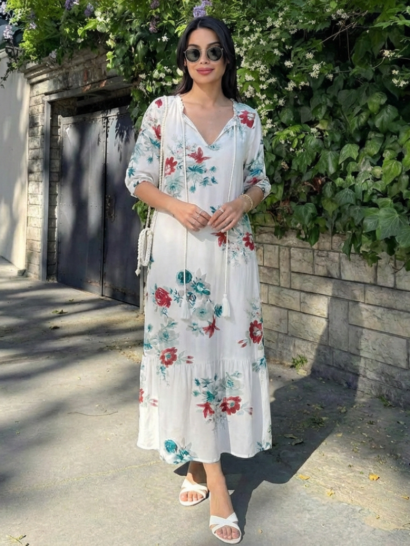 Flowy women's floral midi dress featuring a flattering V-neck & short sleeves. Relaxed fit for comfortable summer days.