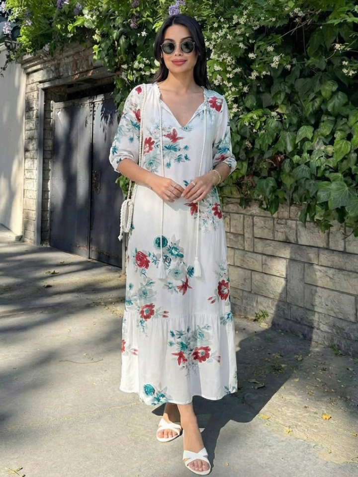 Flowy women's floral midi dress featuring a flattering V-neck & short sleeves. Relaxed fit for comfortable summer days.