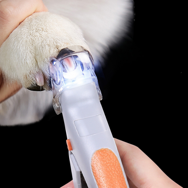 Illuminated pet nail clipper with LED light for safe, precise quick trims on dogs & cats. Comfort grip for easy paw care.
