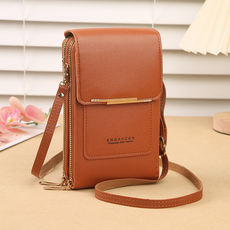 Elegant women's touchscreen phone crossbody bag. Features a wallet function and multiple card slots for organization.