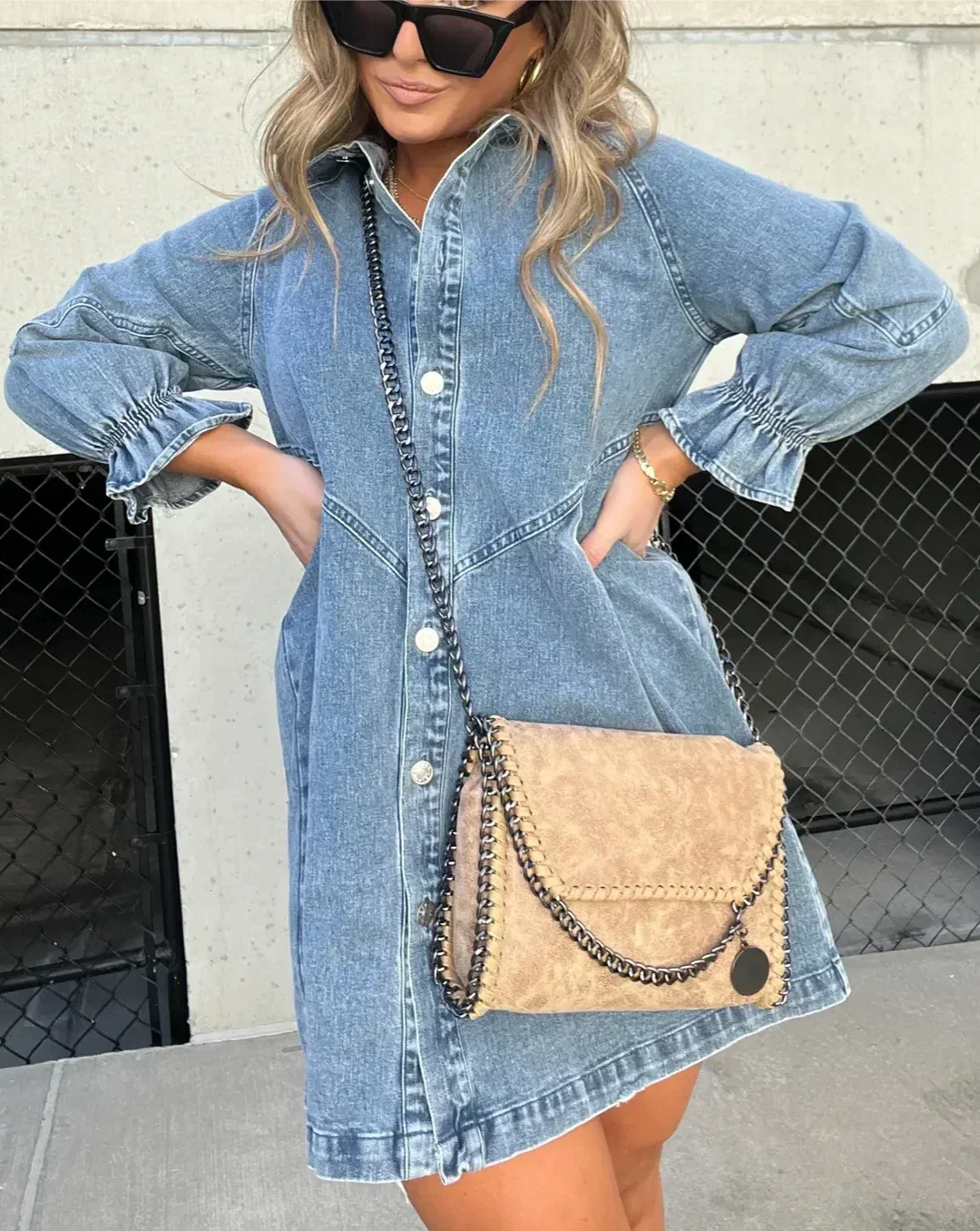 Chic women's denim mini dress, button-down design, great for everyday summer fashion.