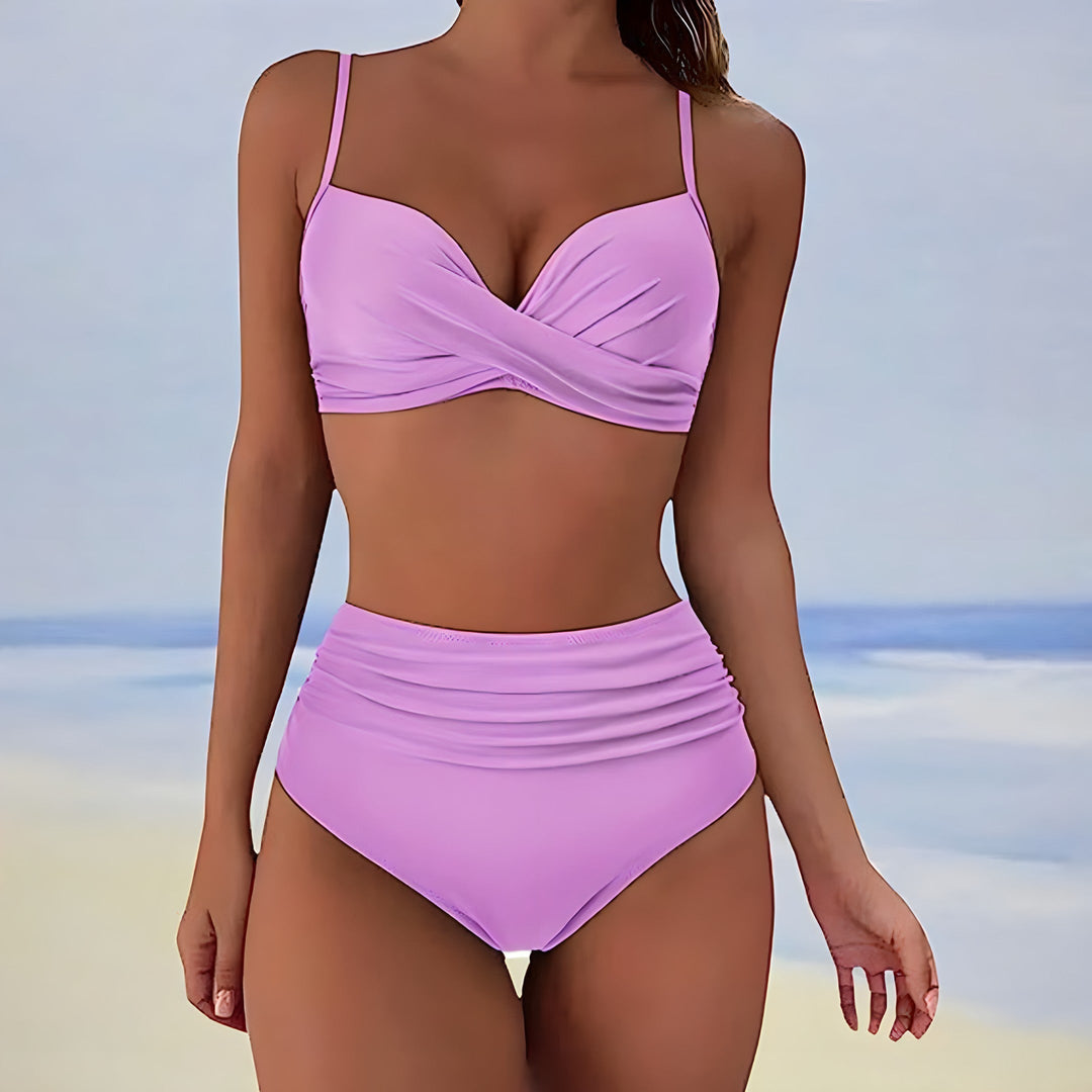 Two-piece women's swimwear: high waisted bikini with unique twist front design, flattering fit.