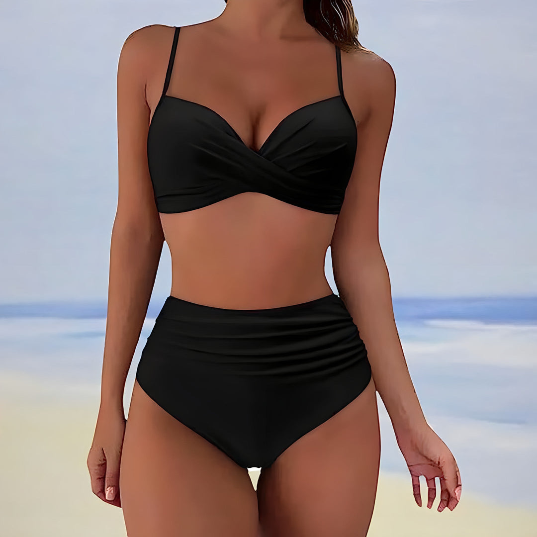 Flattering two-piece women's swimwear; high waisted bikini with stylish twist front top.