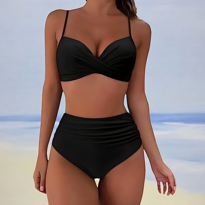 Flattering two-piece women's swimwear; high waisted bikini with stylish twist front top.