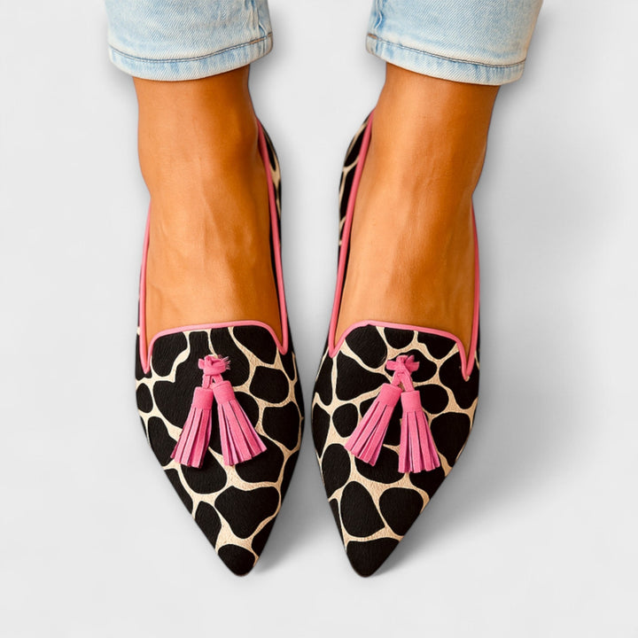 Chic women's slip-on tassel loafers with a stylish pointed toe design for comfortable everyday wear.