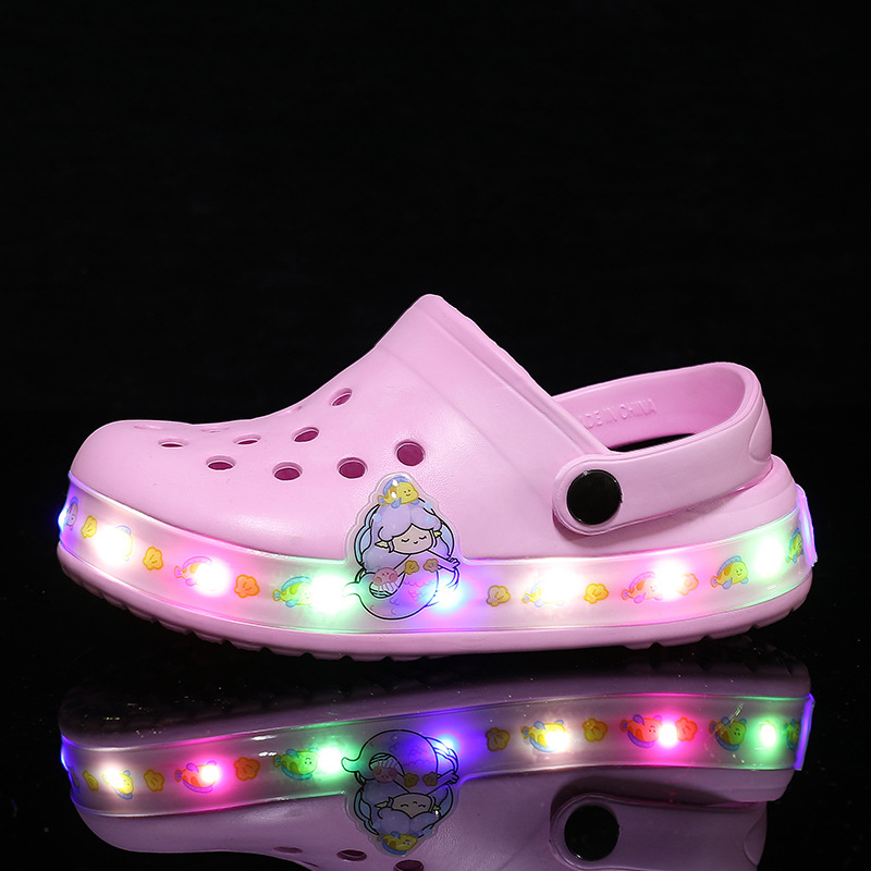 Children's glow-in-the-dark slip-on clogs, perfect beach shoes for water play & summer fun.