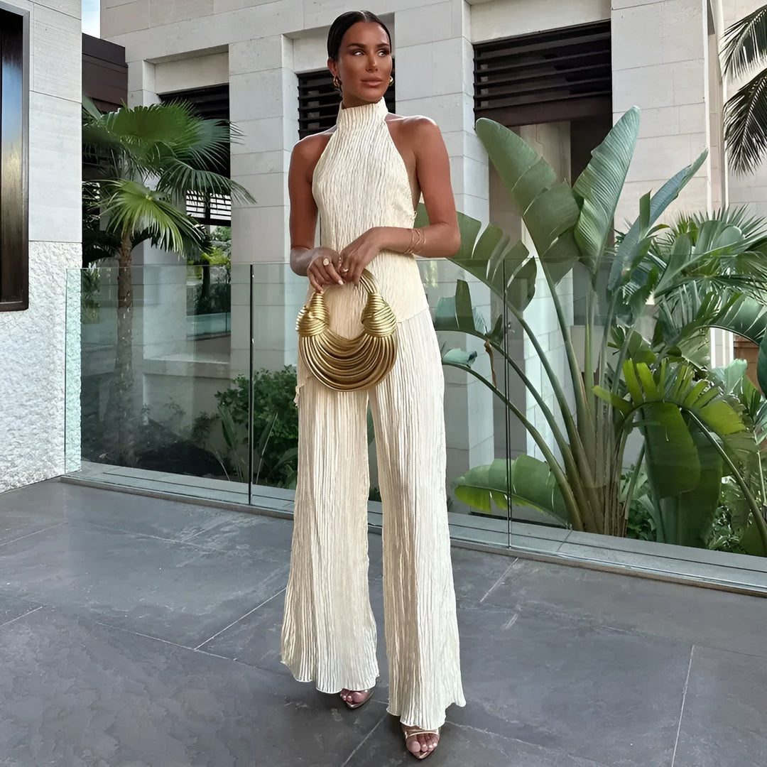 Women's chic two-piece summer set: elegant trousers & casual top. Perfect holiday vacation outfit.